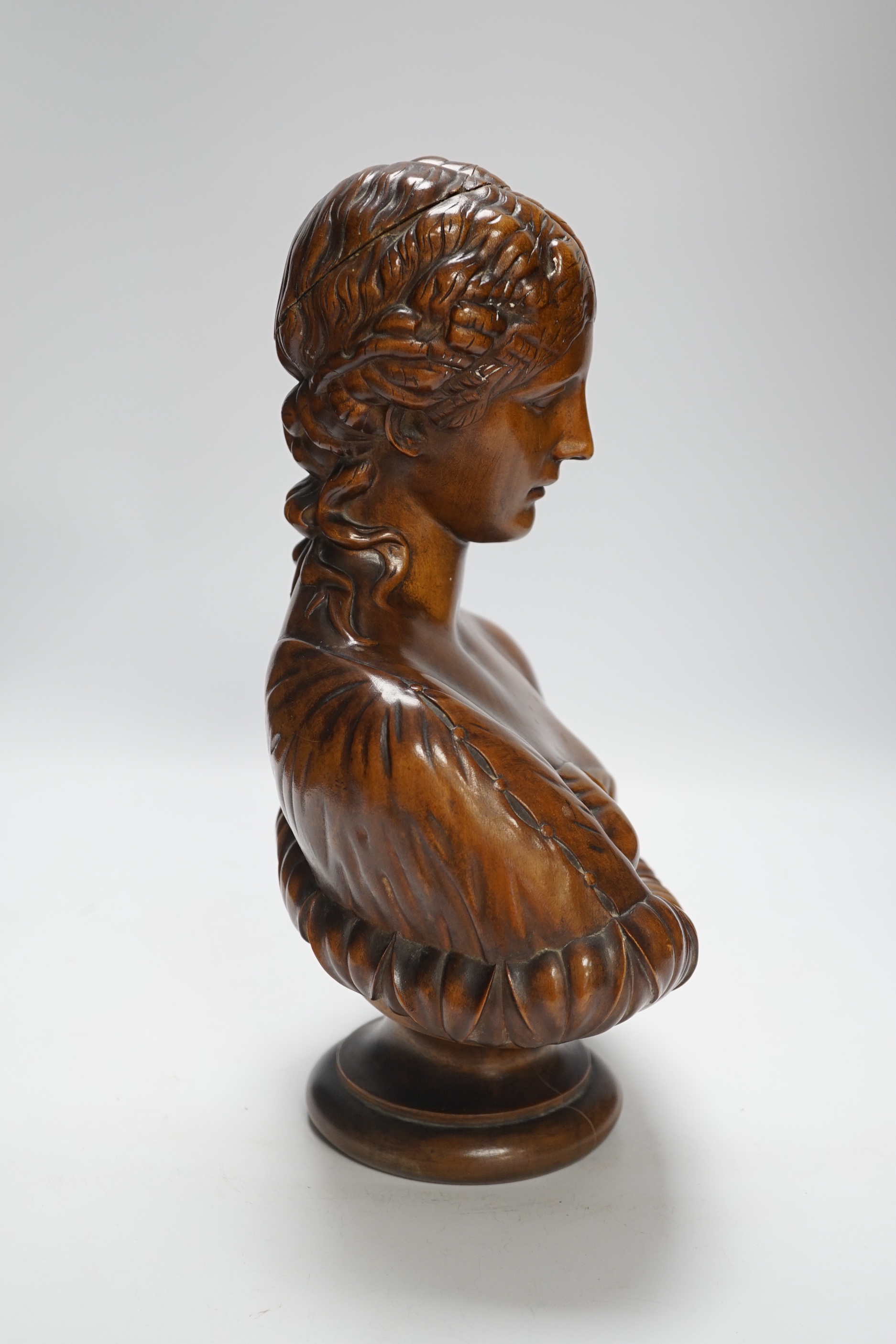 A carved walnut bust of Clytie, possibly Italian, 35cm high